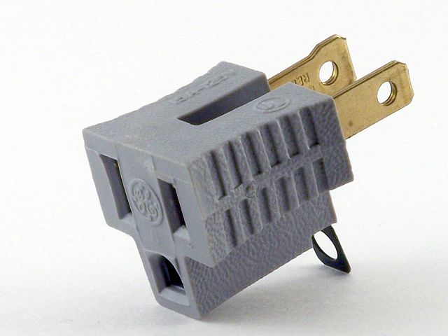 640px-Cheater_plug_edited.jpg